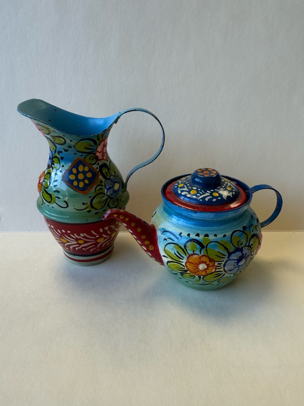 Vintage Metal Folk Art Vibrant Floral Canal Ware Small Teapot and Pitcher Set.